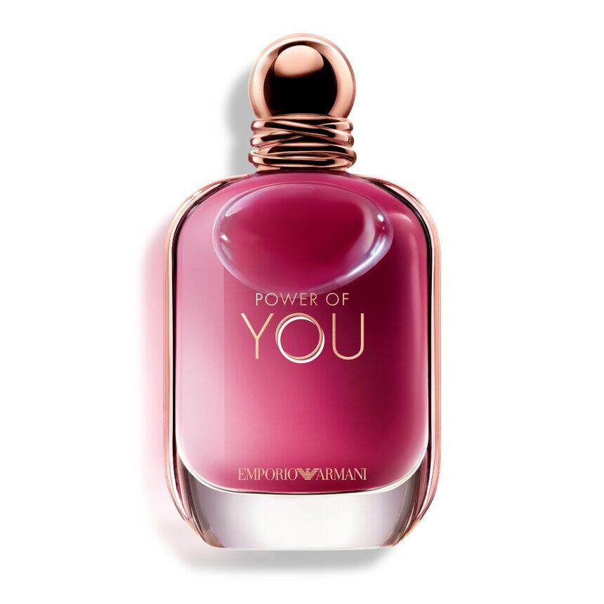 Pink perfume bottle with gold cap on a white background