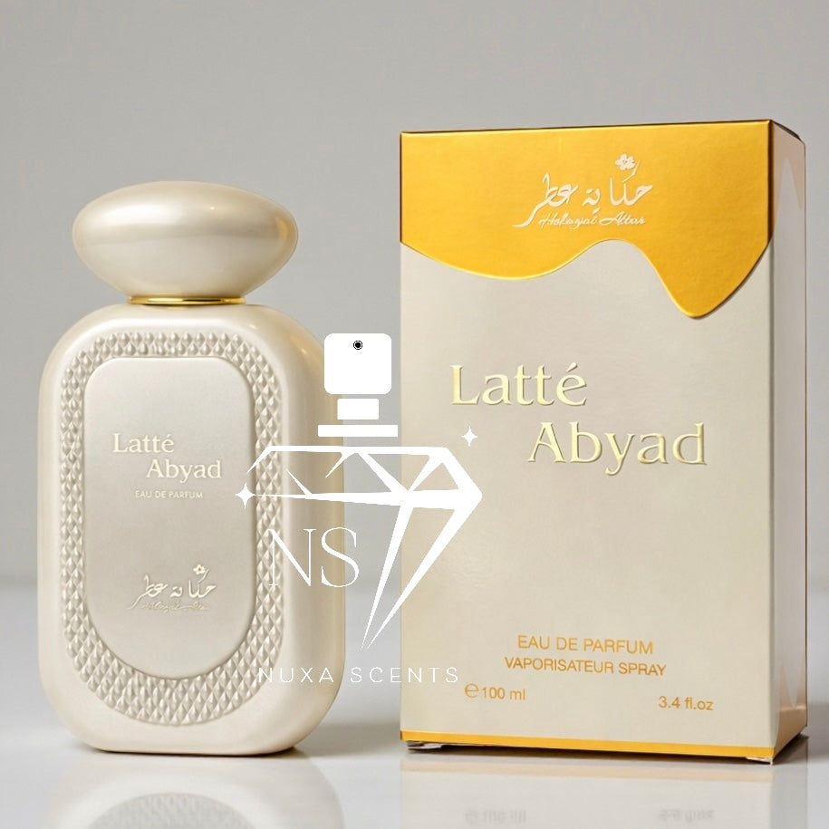 Latte Abyad perfume bottle and packaging on a gray background