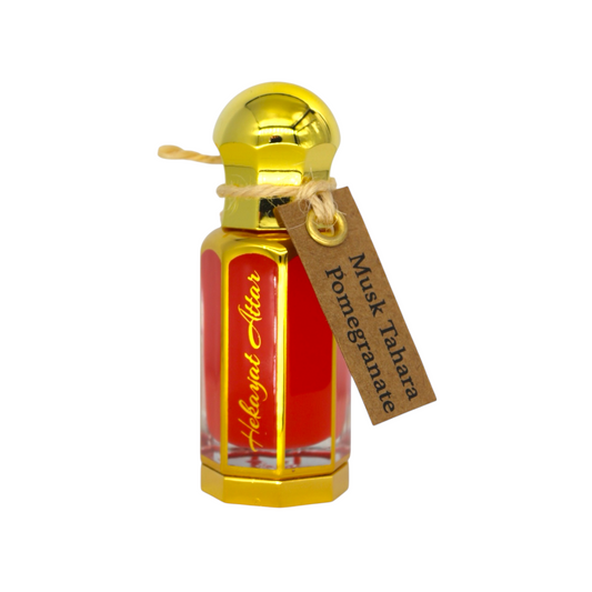 Perfume bottle with gold cap and red label on a white background