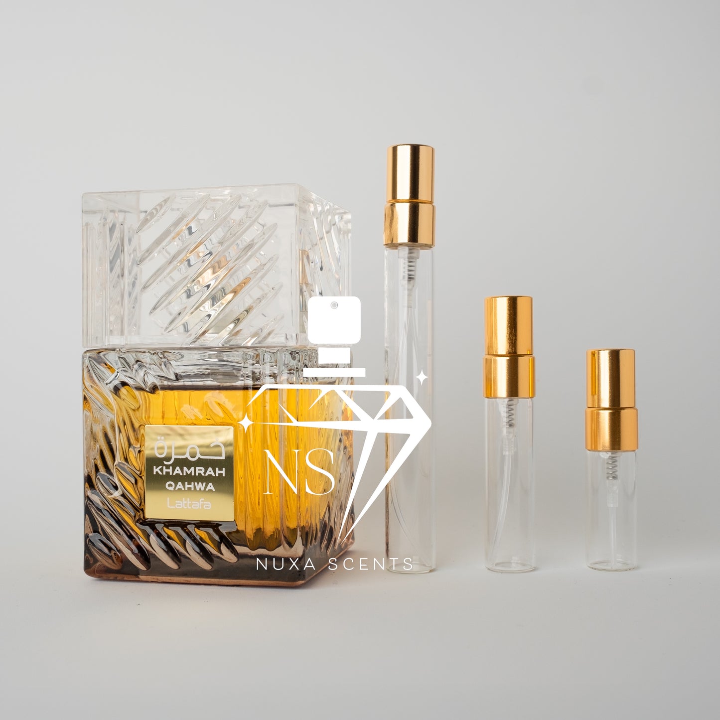 Perfume bottle with gold cap and clear container on a light gray background