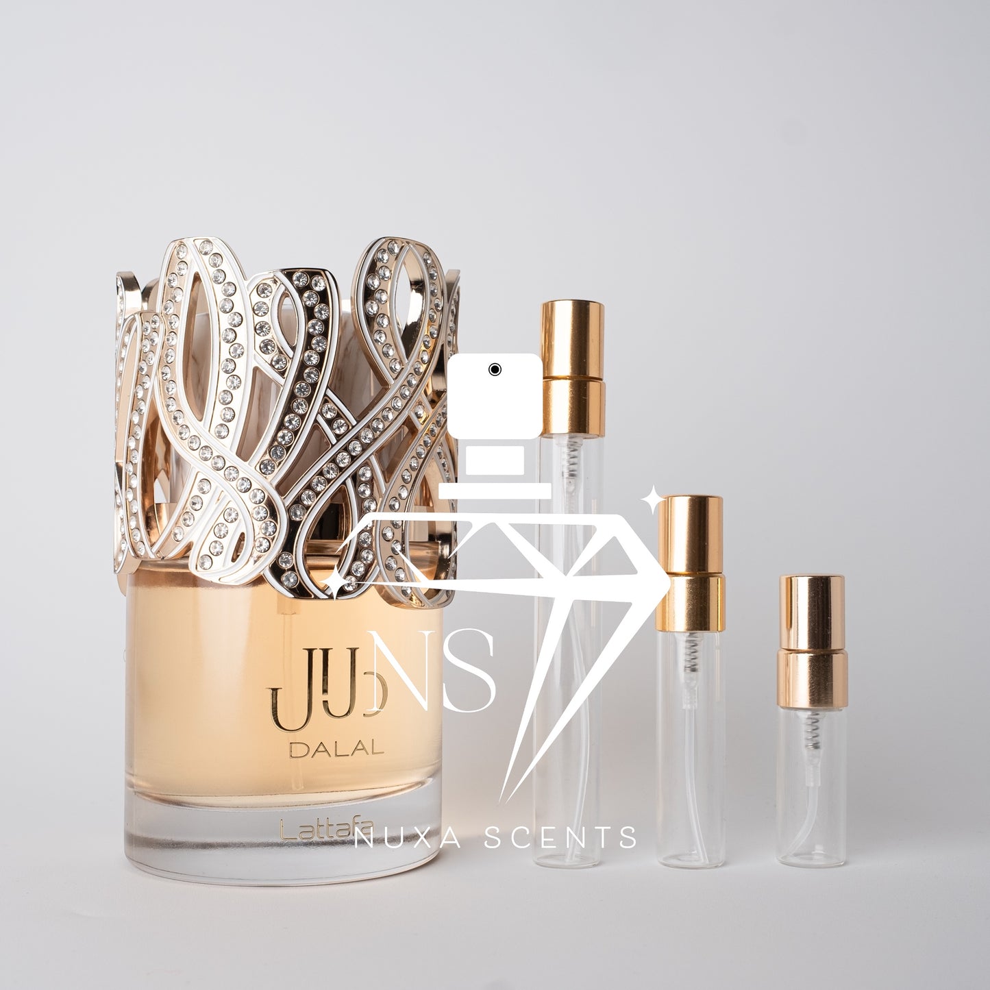 Perfume bottle with 'JUNIS DALAL' branding and smaller bottles on a light gray background.