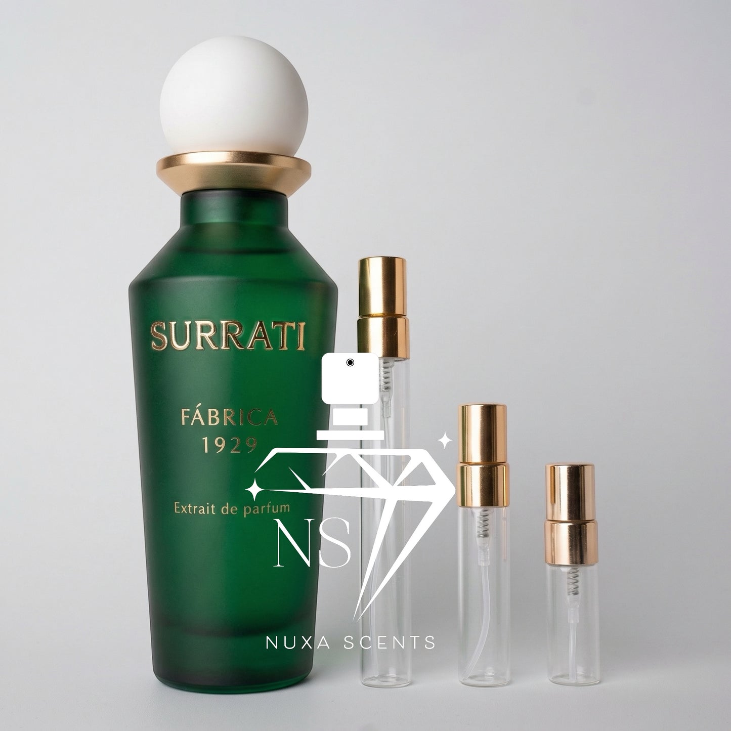 Green Surrati perfume bottle with smaller clear bottles on a light gray background