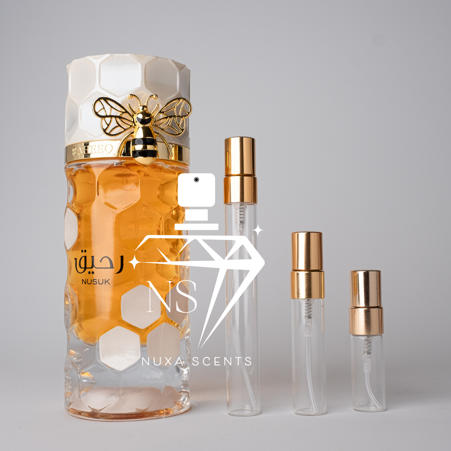 perfume bottle with gold cap and honeycomb design on a gray background