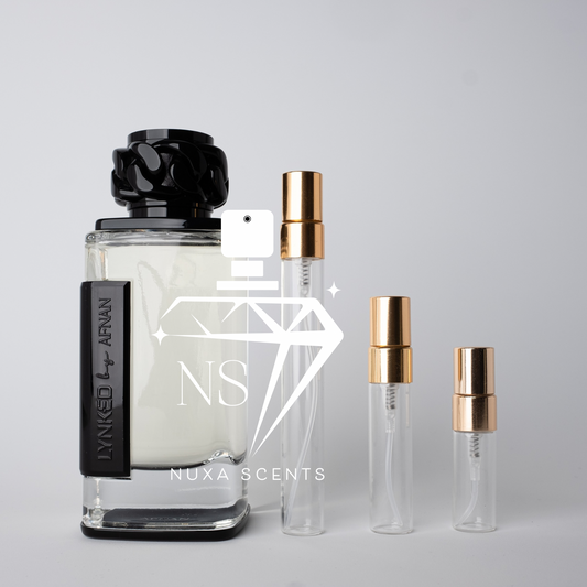 Perfume bottles with gold caps on a light gray background