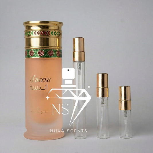 Perfume bottles with gold caps on a gray background, featuring the Nuxa Scents brand.