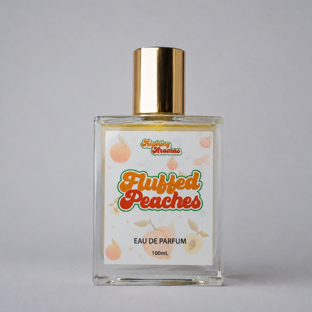 Perfume bottle labeled 'Fluffed Peaches' on a gray background