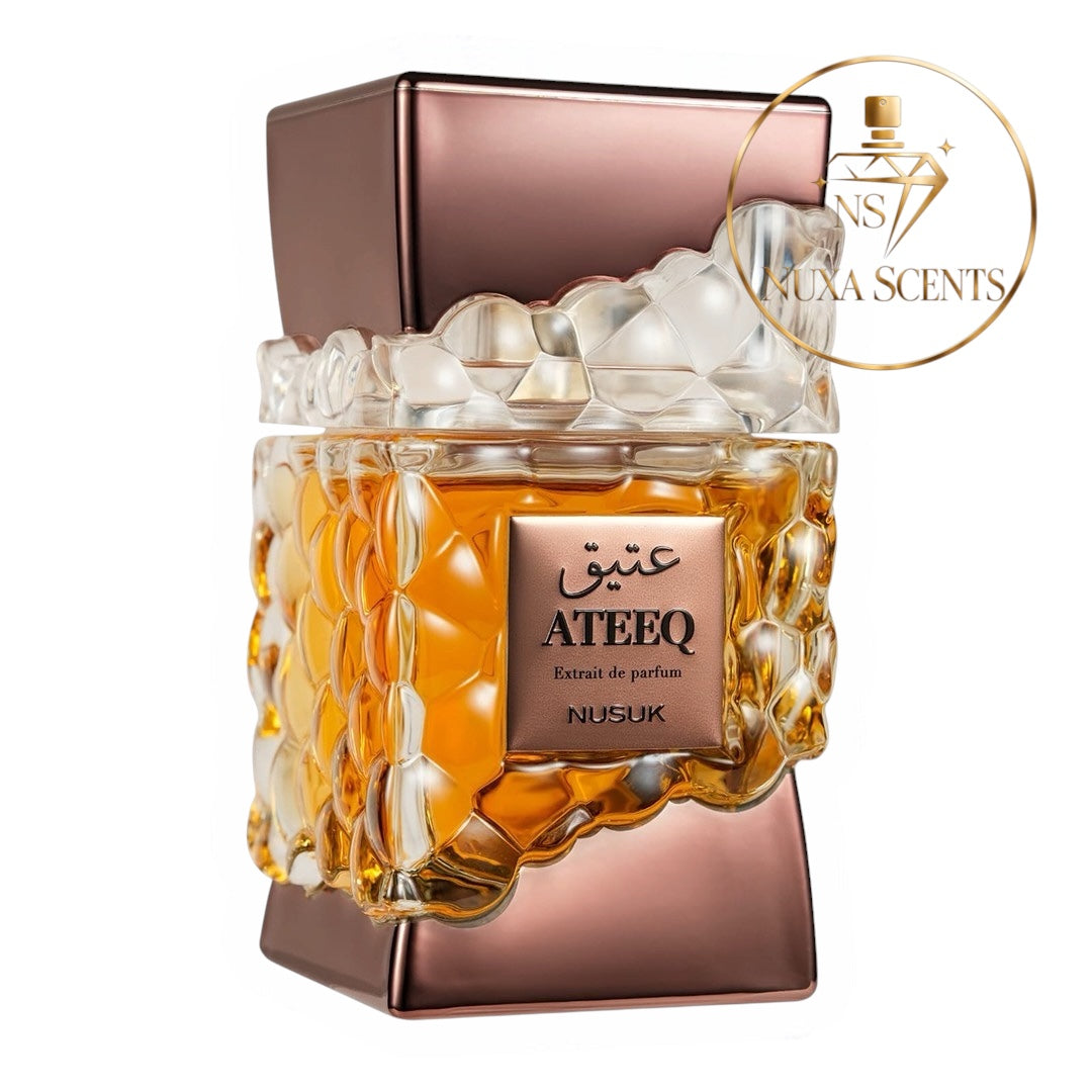Ateeq Extrait de Parfum by Nusuk, featuring a metallic rose gold and clear textured glass bottle with amber-colored liquid inside, set against a plain white background with a Luxa Scents watermark in the top right.