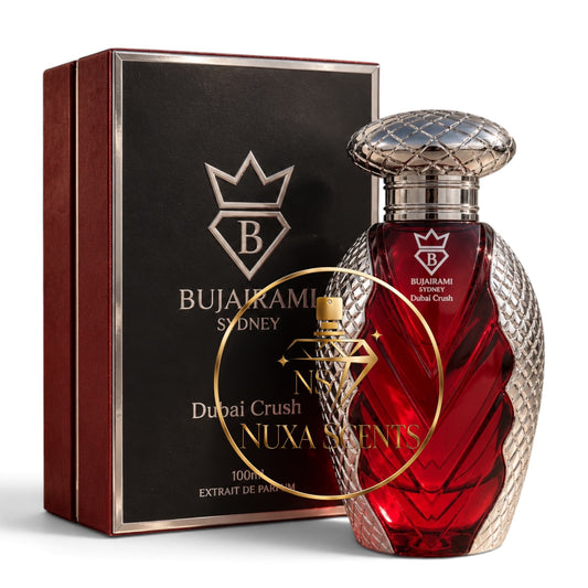 Bujairami Sydney Dubai Crush Nuxa Scents 100ml extrait de parfum bottle with a textured red glass body and silver cap, shown next to its black and dark red packaging box.