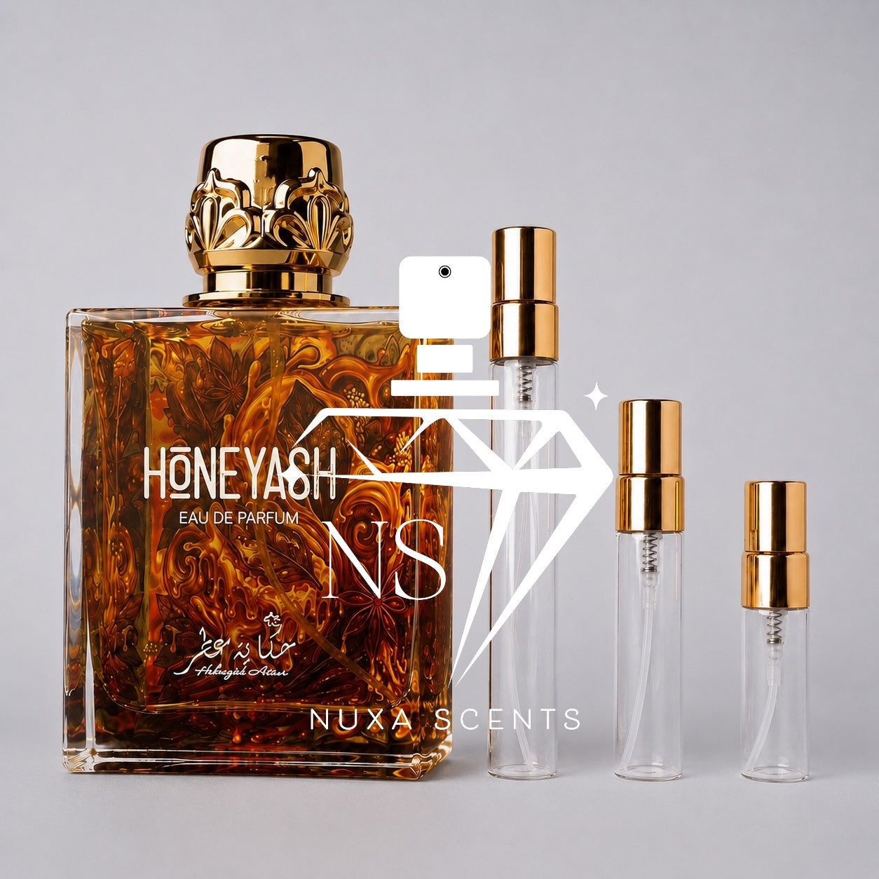 A bottle of HoneYASH Eau de Parfum with amber liquid and a gold cap, shown alongside three clear sample spray vials with gold collars on a light gray background. A large white 'NS' logo and 'NUXA SCENTS' watermark overlay the center.
