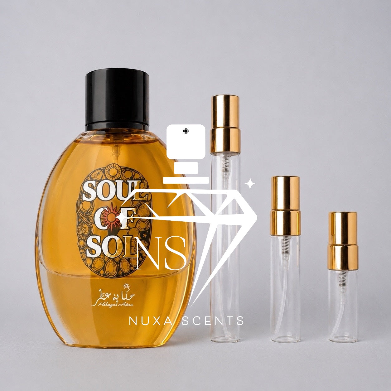 A bottle of Soul of Sol perfume with amber liquid and a black cap, shown alongside three clear glass travel atomizer vials with gold caps on a light gray background. A large white camera-and-diamond watermark with the text 'NUXA SCENTS' overlays the center.