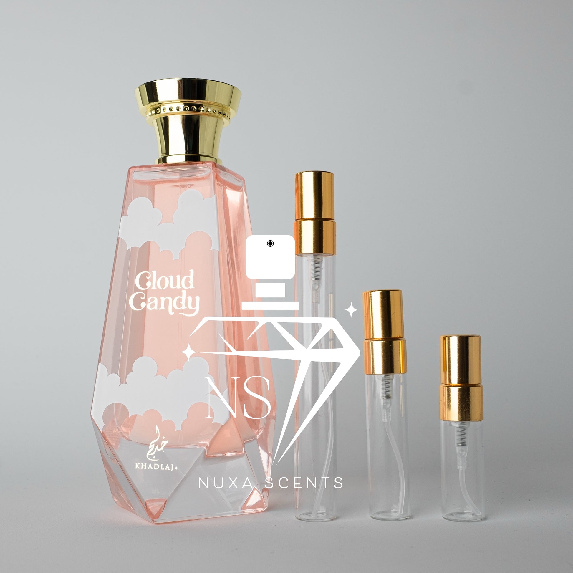 Set of perfume bottles with gold caps on a gray background