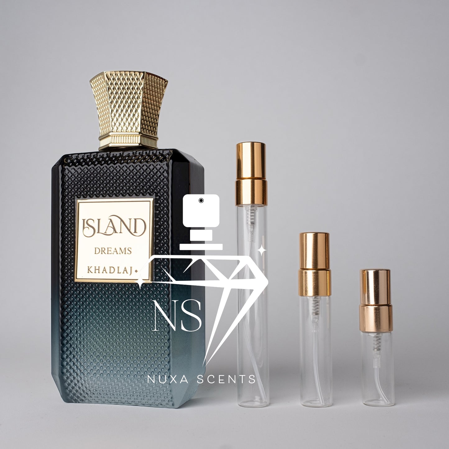 Perfume bottle with gold cap and black textured bottle, accompanied by two smaller clear bottles with gold caps on a gray background.