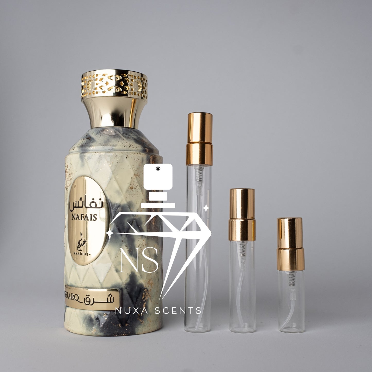 Perfume bottle with gold cap and khadlaj branding on a gray background