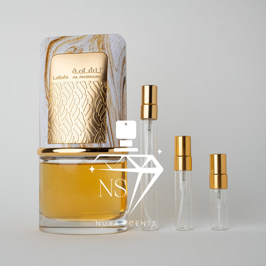 Perfume bottle with gold cap and clear container, featuring lattafa Accents branding.