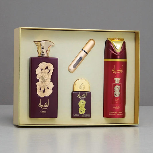 Set of perfume bottles in a gold box on a gray background