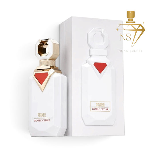 Noble Cedar French Agreste perfume bottle and its white packaging box, featuring a white faceted bottle with a red and gold geometric accent and a matching white box. A gold Nuya Scents logo is visible in the top right corner.