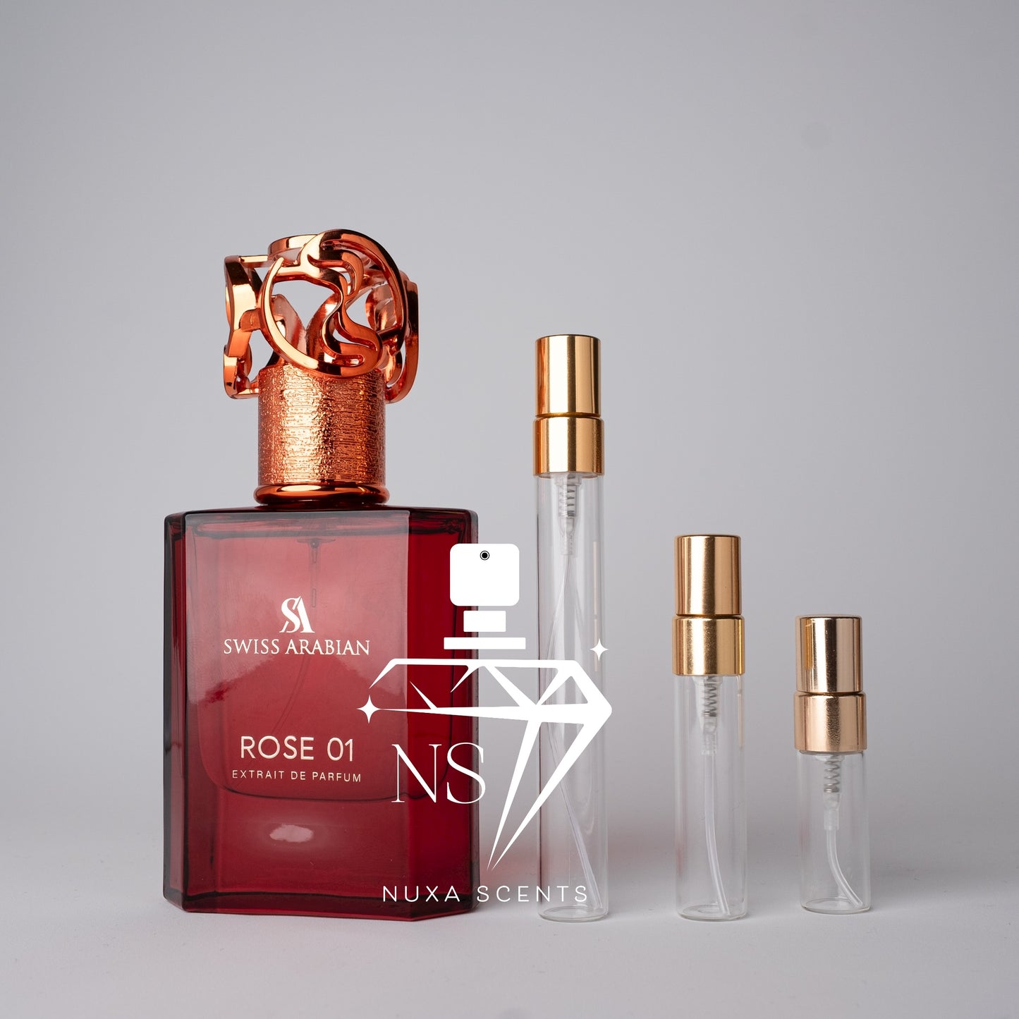 Swiss Arabian Rose 01 perfume bottle with three smaller bottles on a gray background