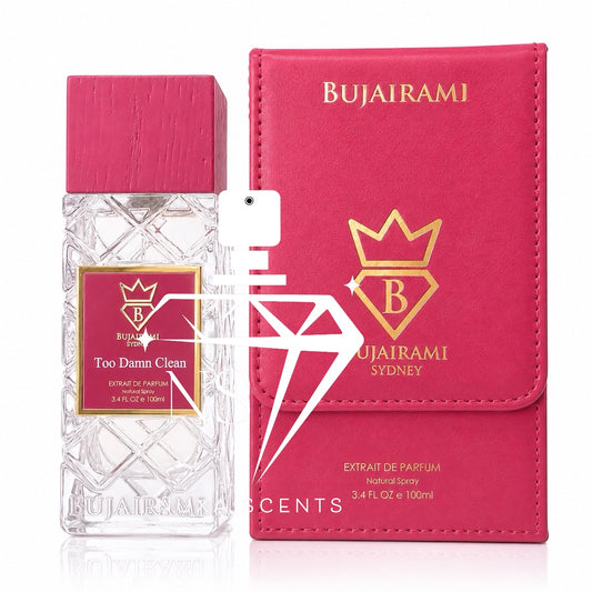 Bujairami Too Damn Clean perfume bottle next to its pink faux-leather travel spray case, both featuring gold and pink branding on a white background.
