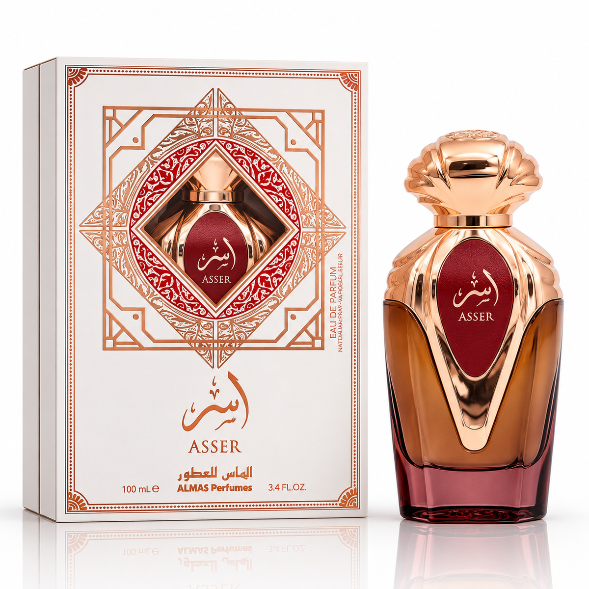 Asser Eau de Parfum bottle and its ornate white and gold packaging box, featuring a deep red label with gold Arabic calligraphy and the brand name ASSER.