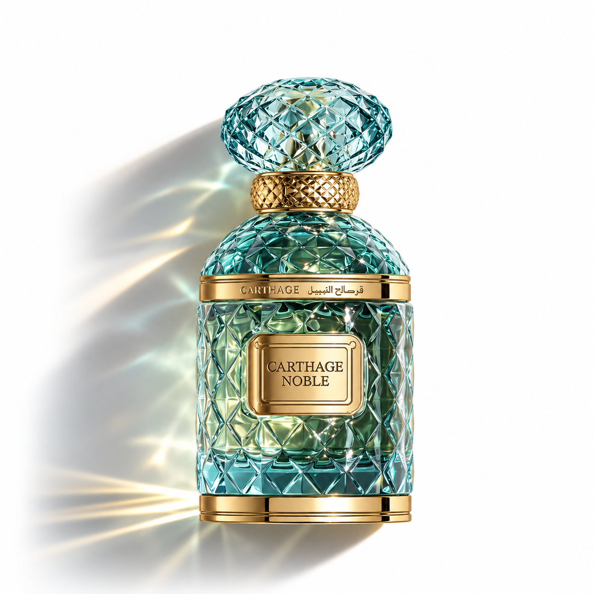 A luxury fragrance bottle from GARTHAGE NOBLE, featuring a textured, faceted aqua glass body and a matching cap, accented with polished gold metal bands and a gold label, set against a clean white background with dramatic light rays.