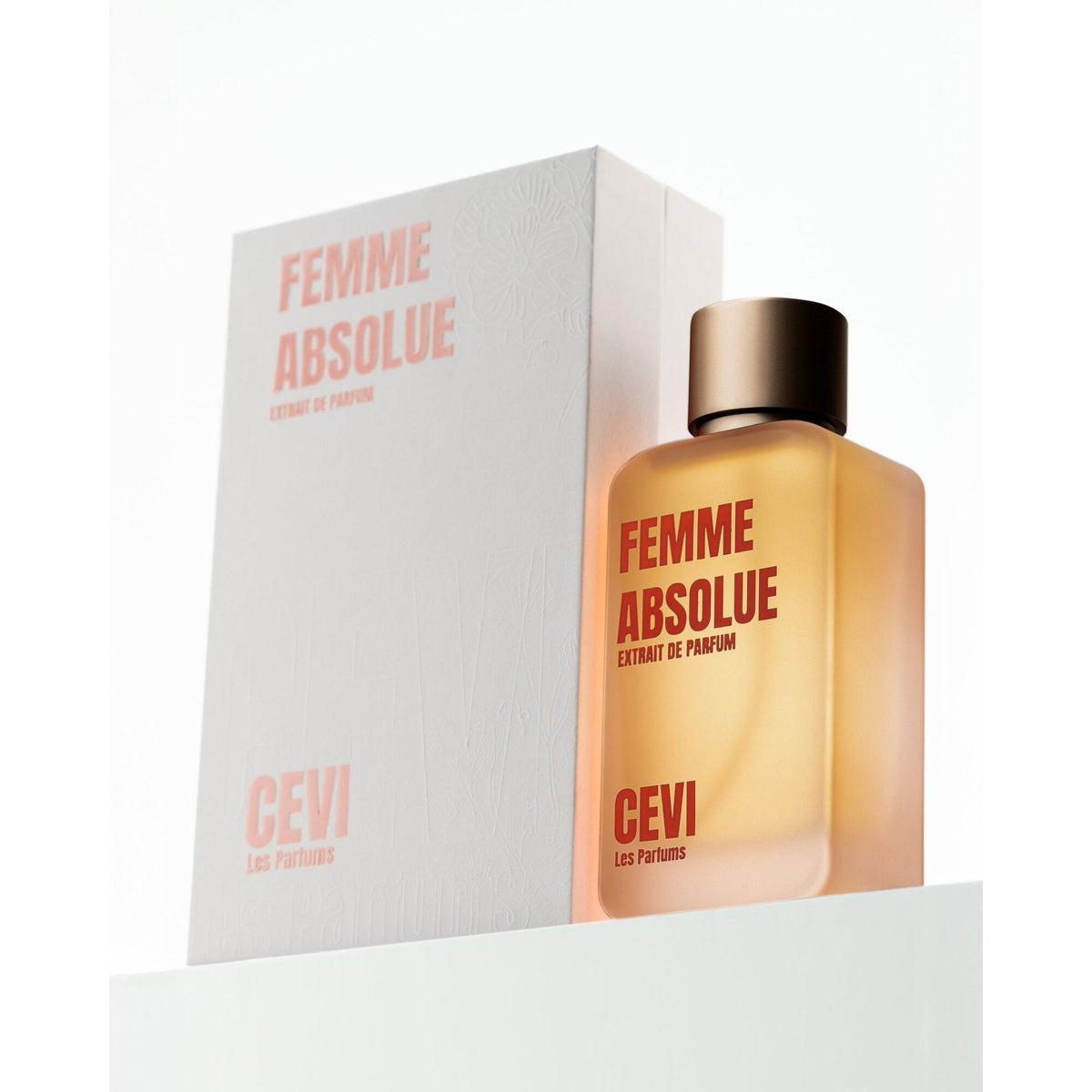 Femme Absolue by Cevi Les Parfums 100ml extrait de parfum, peach bottle with dark gold cap in front of its white box | Nuxa Scents