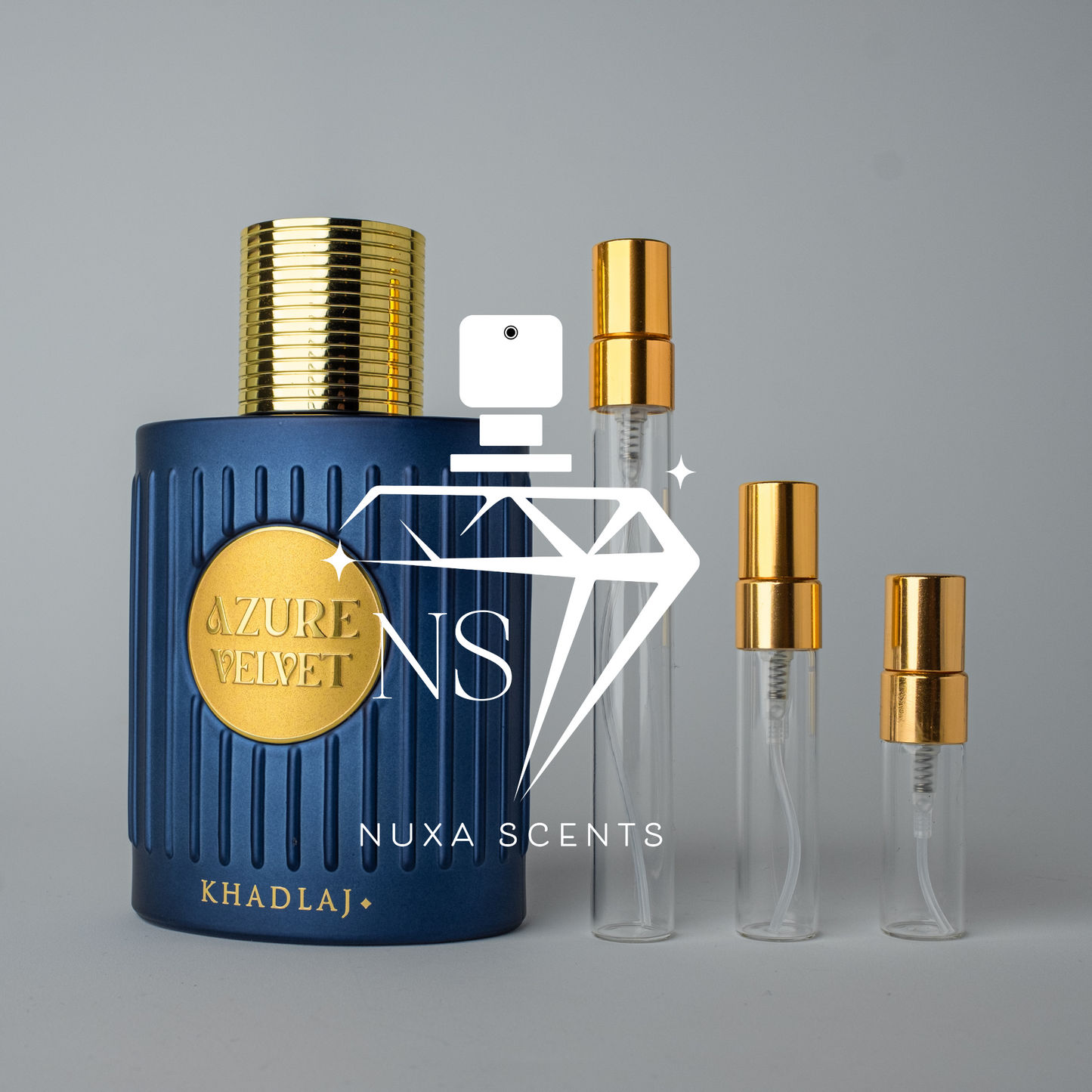 Blue perfume bottle with gold cap and 'Nuxa Scents' branding on a gray background