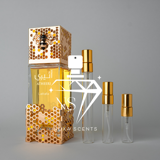 Perfume bottle with gold cap and decorative packaging on a gray background