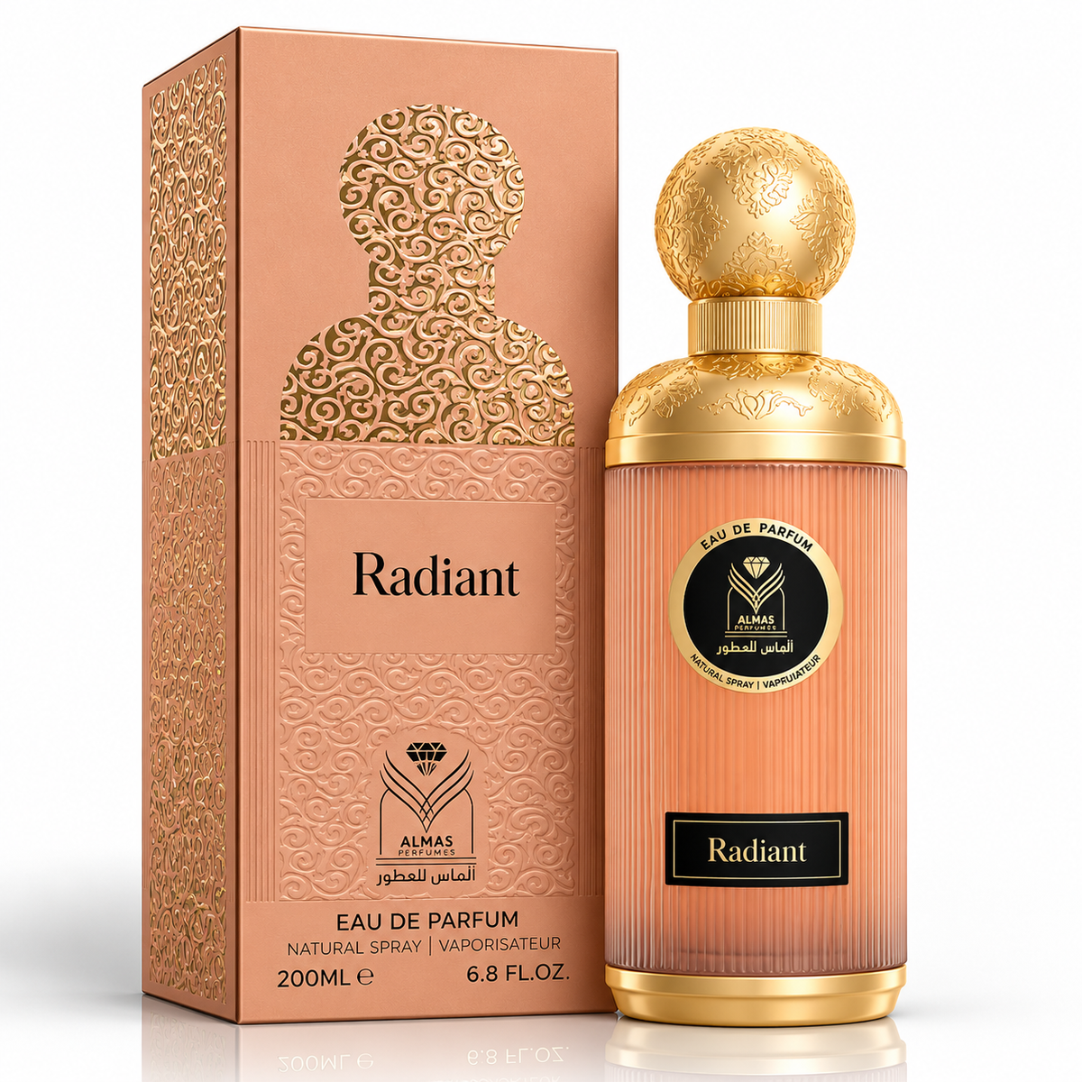 Almas Radiant Eau de Parfum bottle with a gold cap and a peach-colored ribbed body, standing next to its matching peach and gold packaging box on a white background.